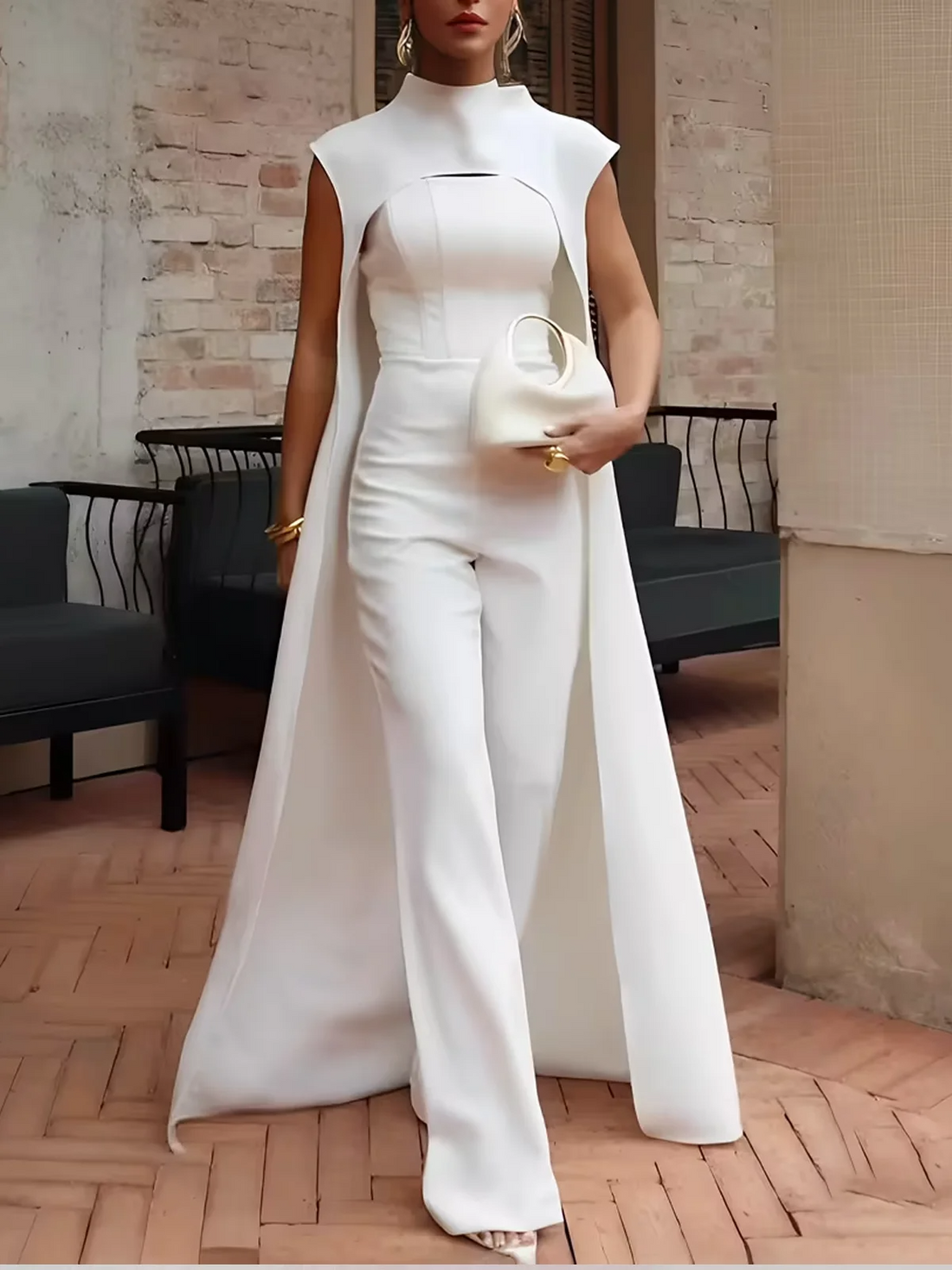 Elegant tailored white jumpsuit with flowing cape and stand collar for weddings and formal occasions